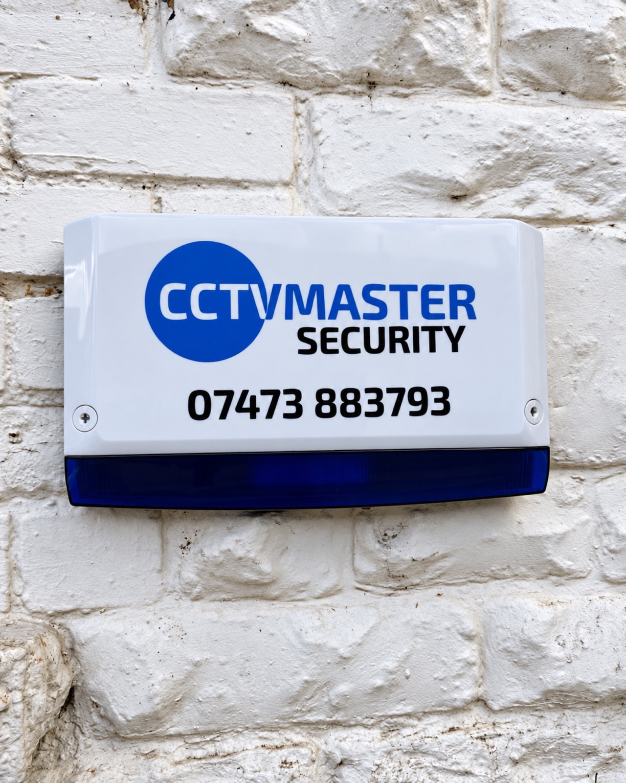 CCTVMaster branded alarm sounder mounted on a white stone wall