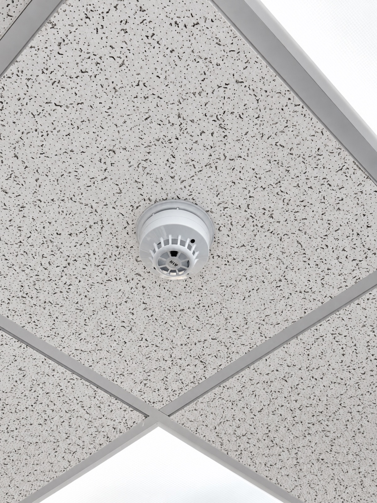 Fire detector installed in a suspended tile ceiling