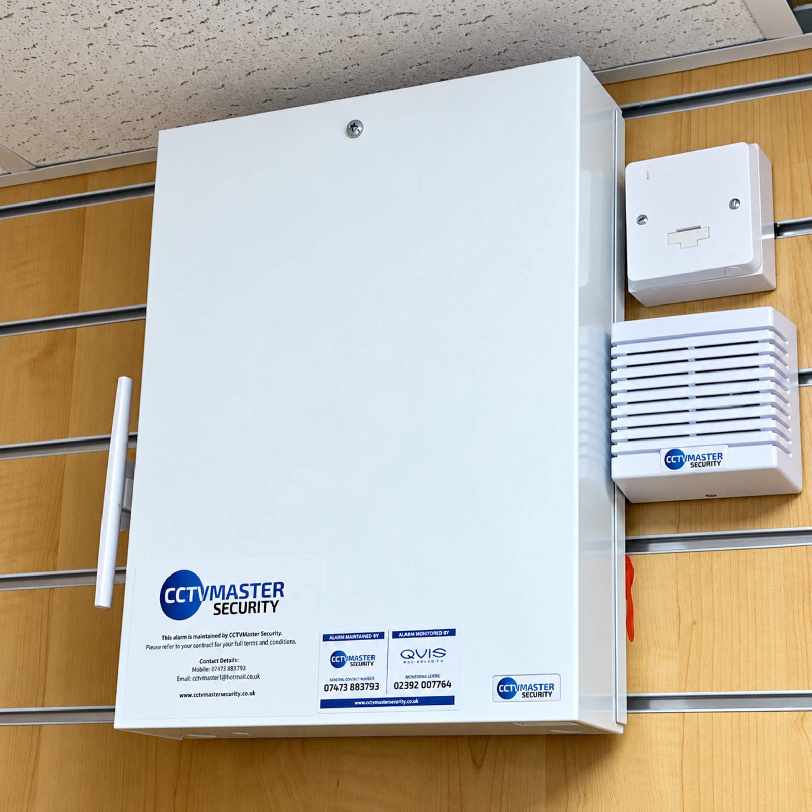 CCTVMaster alarm control cabinet and indoor sounder on a timber wall
