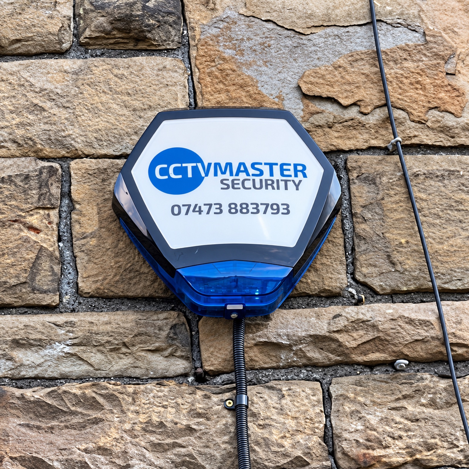 CCTVMaster branded external alarm sounder mounted on a stone wall